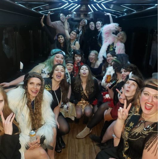Group photo inside of party bus